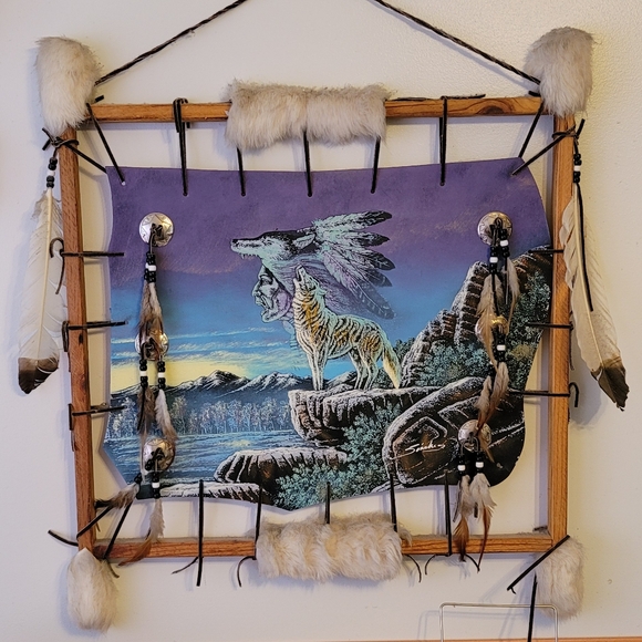 Native american art painted on hide with fur and feathers